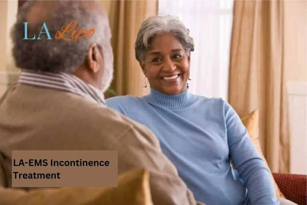 Couple sat smiling at each other - LA-EMS treatment Cannock